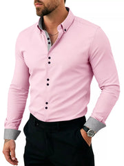 Model wearing navy shirt showing button placket and patterned cuffs