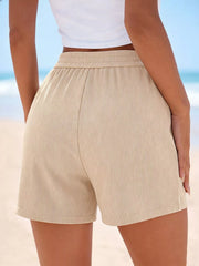 Back view of beige high-waisted shorts