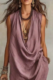 Close front view of mauve sleeveless dress showing deep draped neckline
