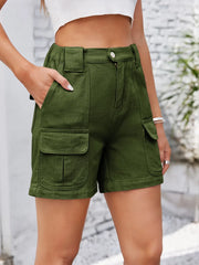 Front view of olive shorts with hands in pockets.