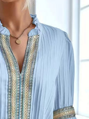 Notched textured balloon-sleeve blouse in blue close front view