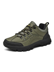 Olive green lace-up shoe with black treaded sole and toe cap, product view