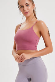 Model wearing the rose-pink cami with lilac leggings, shown from the front.