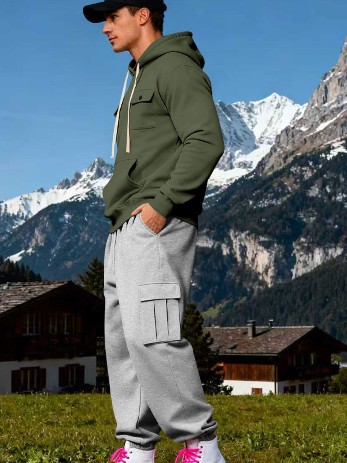 Side view of olive drawstring hoodie and grey sweatpants showing a large thigh cargo pocket