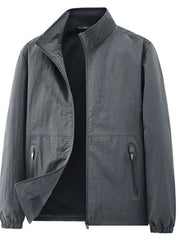 Charcoal grey stand-collar jacket displayed from the front with a turned-back panel