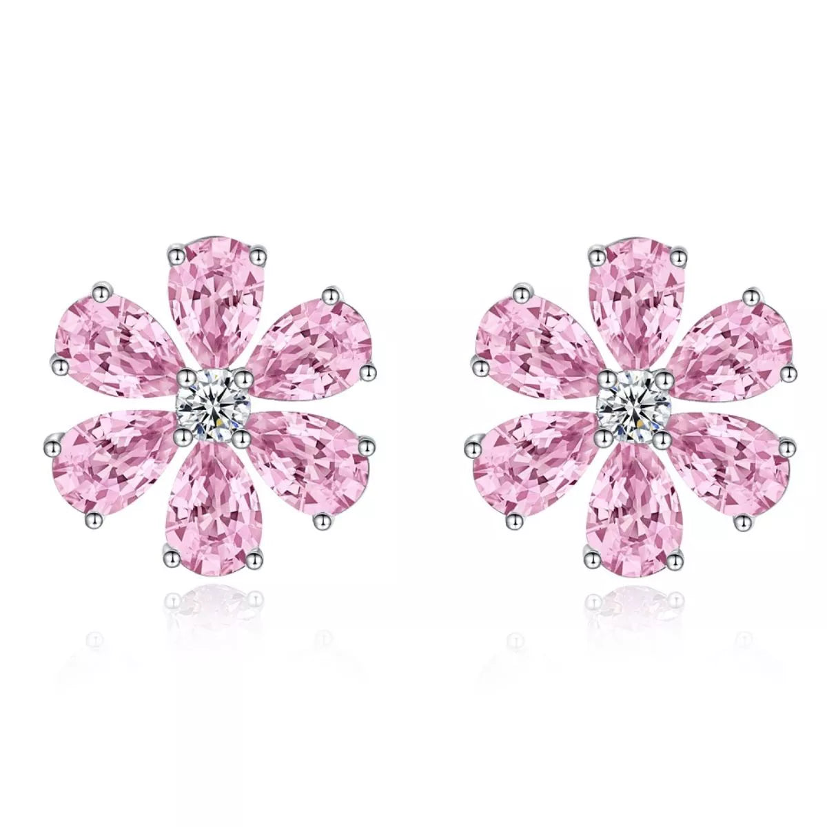 Pink flower stud earrings on white background showing teardrop petals and clear centres
