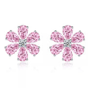 Pink flower stud earrings on white background showing teardrop petals and clear centres