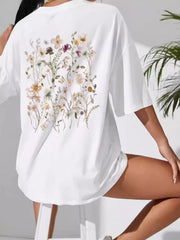 White oversized short-sleeve tee with large wildflower print across the back