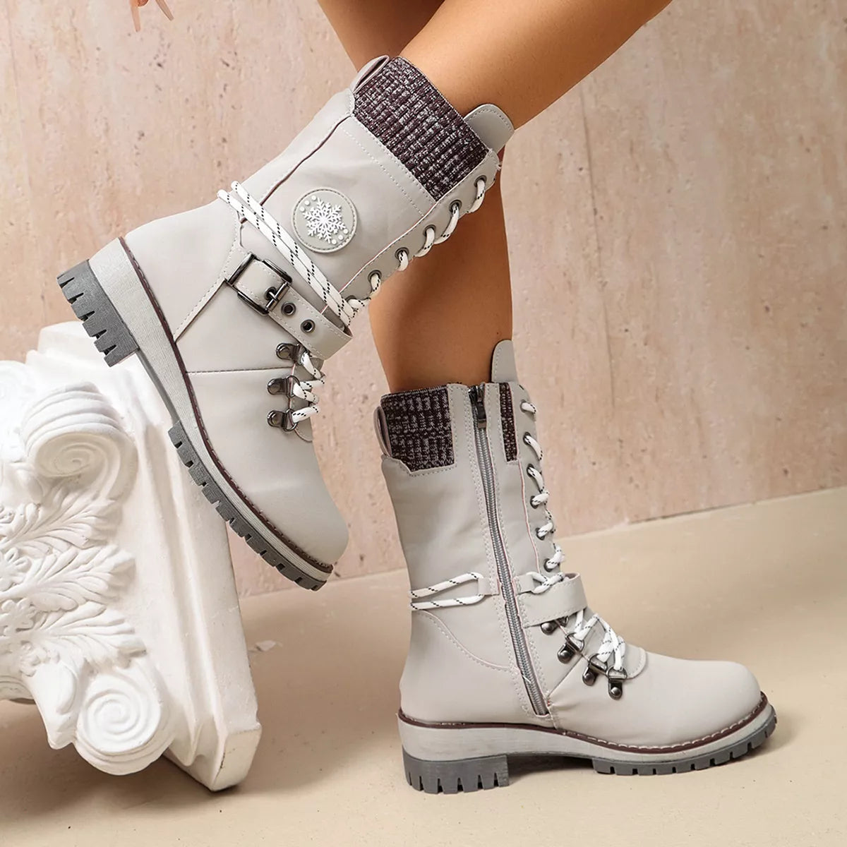 White ankle boots shown from the side