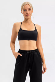 Black crisscross spaghetti-strap active cami and leggings