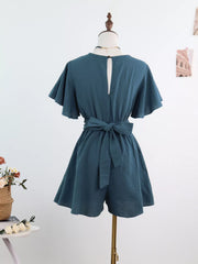 Back view of haze blue romper with tie waist