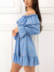Side view of the blue floral ruffle dress with elastic waist and long sleeves.
