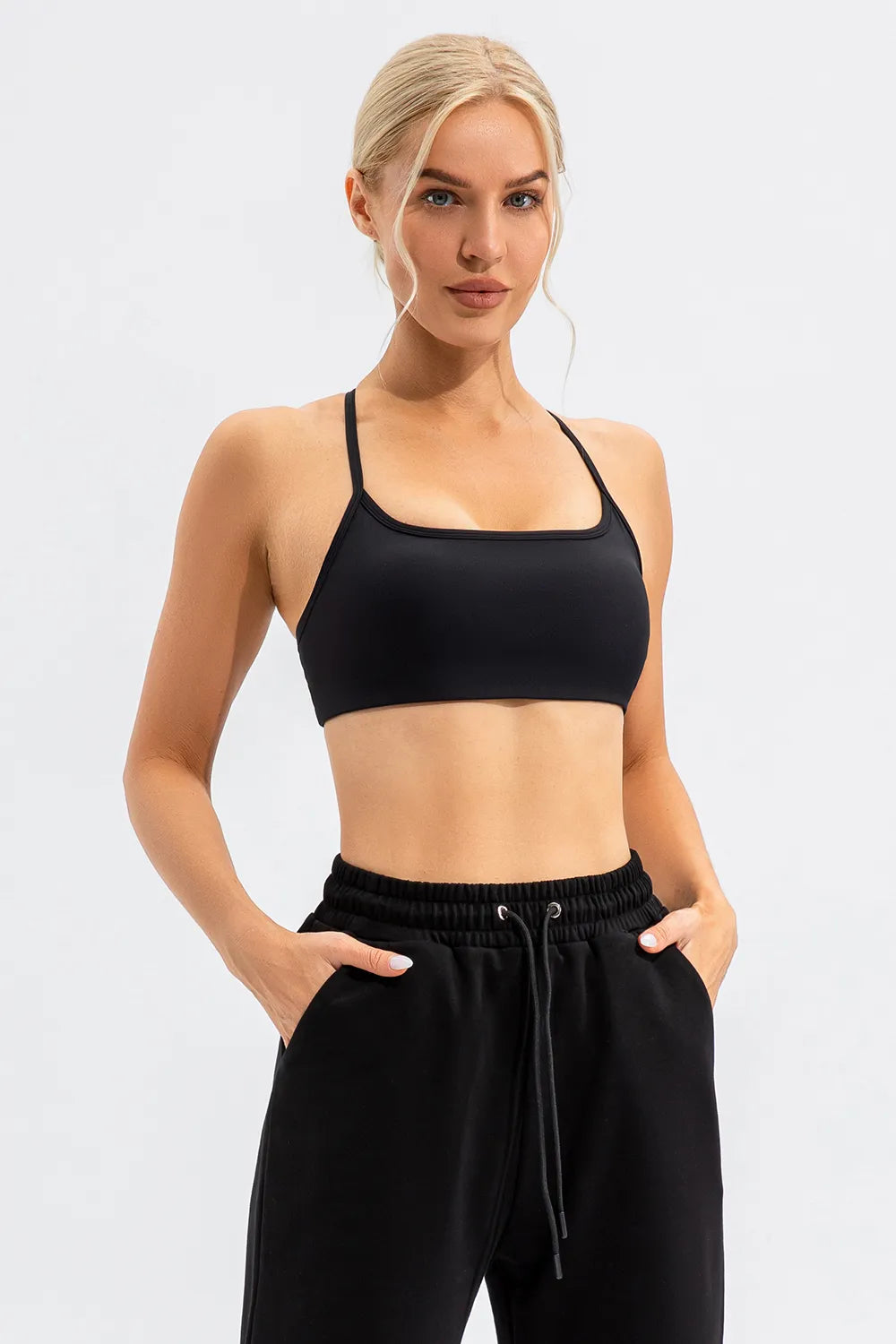 Black cami showing crisscross straps at the back