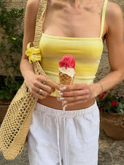 Yellow gradient cami and white pants with crochet shoulder bag