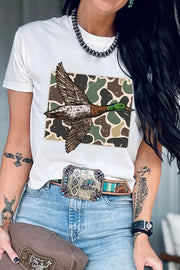 Front view of graphic T-shirt tucked with jeans and western belt
