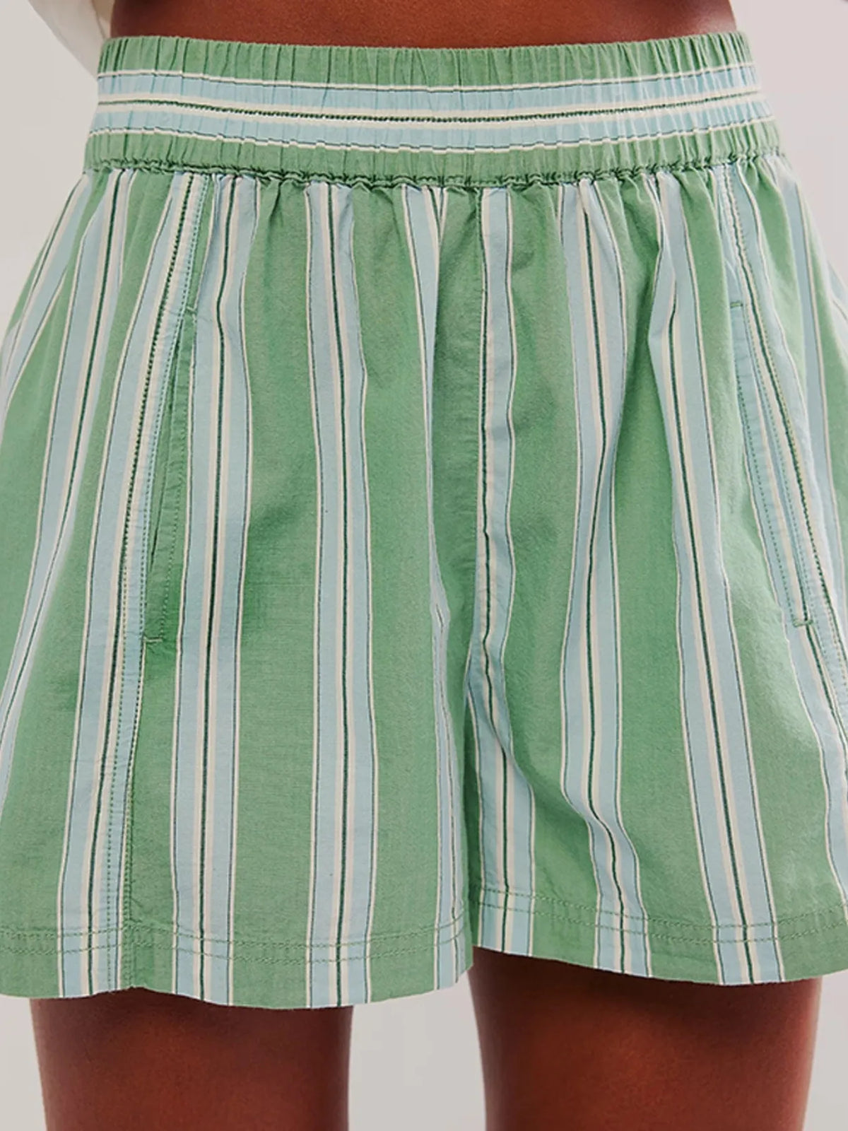 Rear close-up of mint striped shorts and gathered waistband