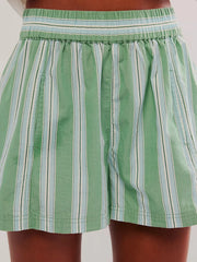 Rear close-up of mint striped shorts and gathered waistband