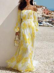Yellow-and-white patterned off-shoulder maxi dress styled with a small handbag