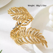 Gold-tone leaf cuff bracelet with width measurement text