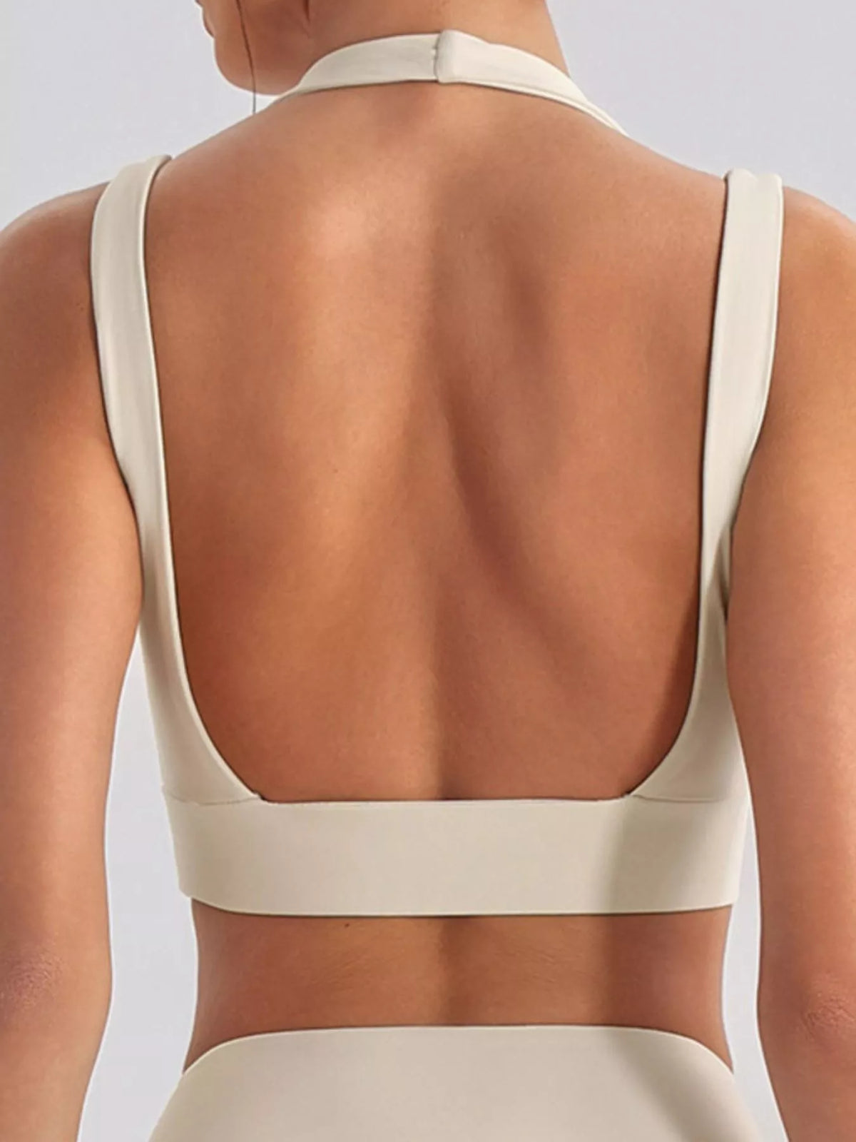 Side view of seamless criss-cross v-neck tank and leggings active set