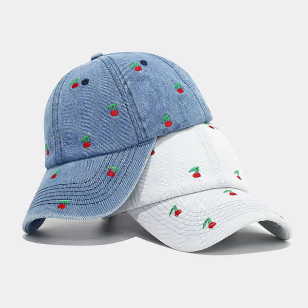 Blue denim baseball cap with embroidered red cherry pattern on crown