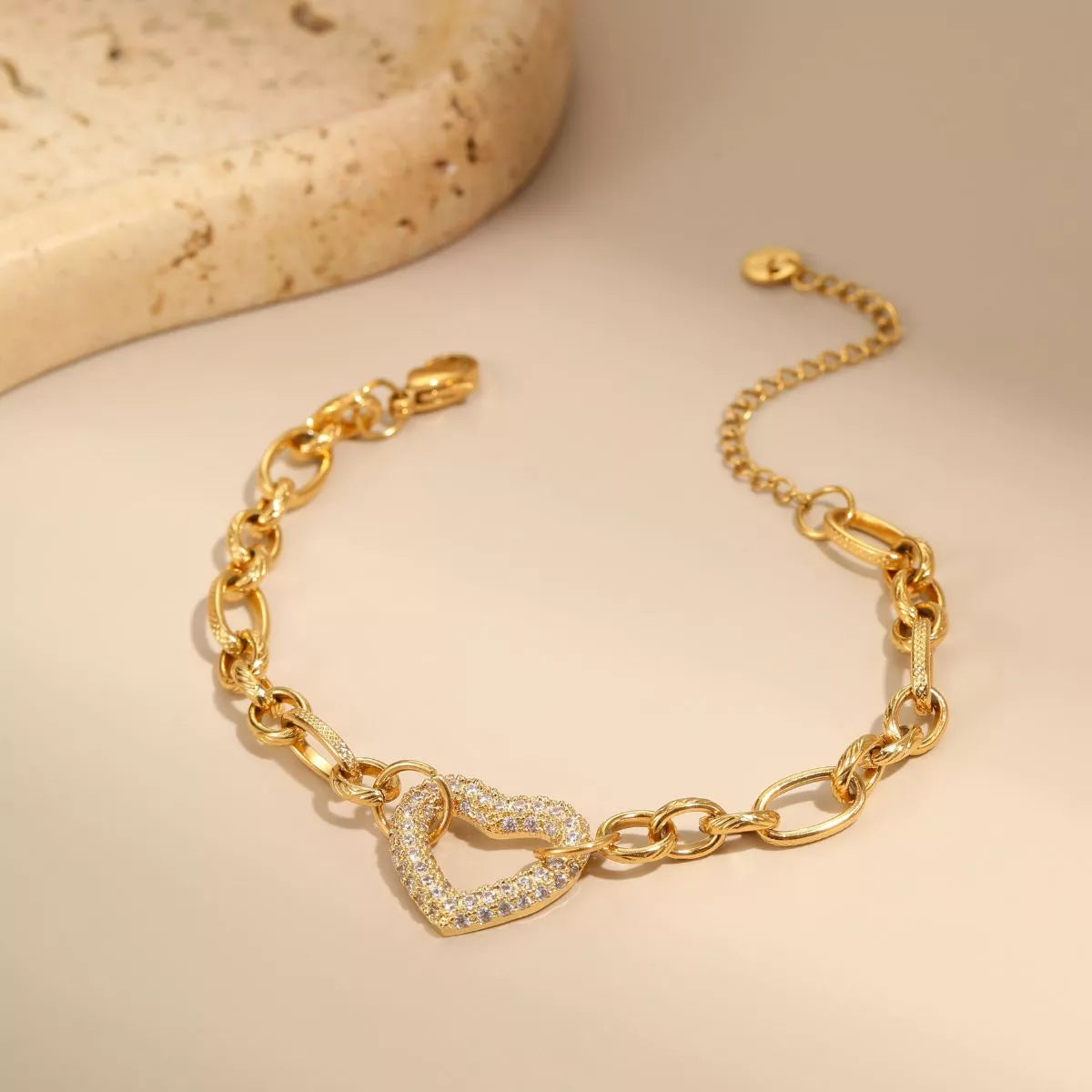 Gold-tone rhinestone chain bracelet arranged in a loop