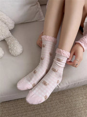 Model wearing pink bear-print crew socks