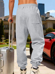 Side view of gray cargo joggers with large pocket