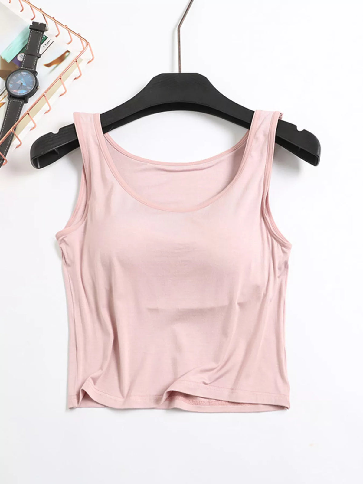 Pink seamless padded tank top on hanger, front view