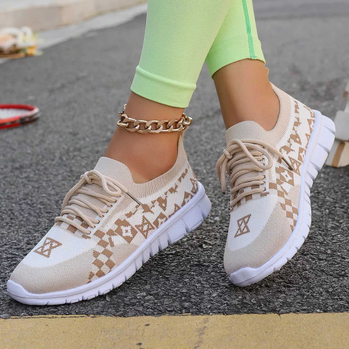 Side view of cream mesh lace-up sneakers with tan geometric detailing