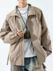 Beige raglan jacket modeled with one hand holding the open front