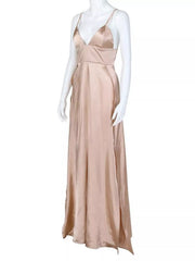 Three-quarter view of the flowing skirt and V-neck bodice of the blush maxi dress