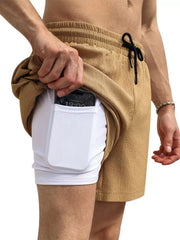 Model showing the inner liner pocket of tan shorts