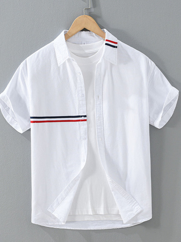 White short-sleeve button-front shirt with red and navy contrast stripes, shown on a hanger