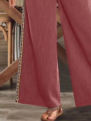 Close view of dusty rose side stripe and hem