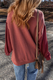 Back view of mauve sweatshirt on model