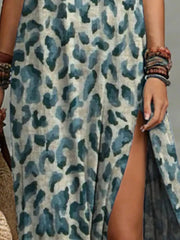 Close-up of the blue-gray leopard print and side slit on the maxi dress.