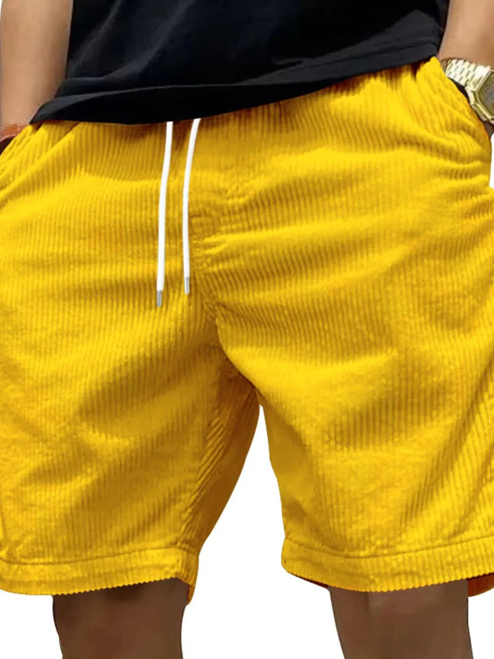 Model wearing yellow drawstring shorts, back view