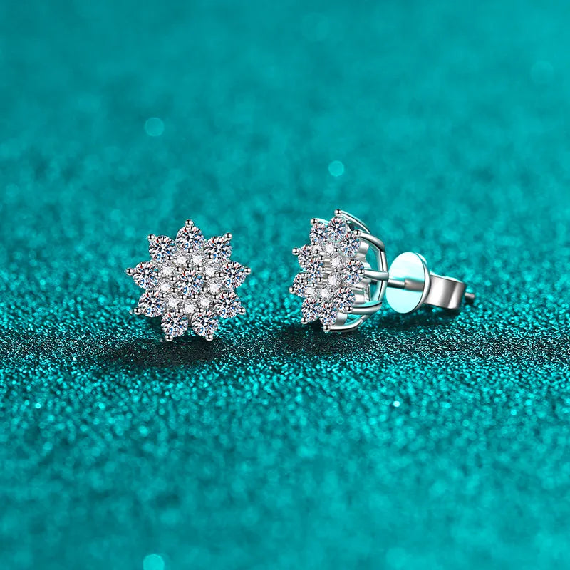 Pair of floral cluster moissanite and zircon studs viewed at an angle