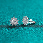 Pair of floral cluster moissanite and zircon studs viewed at an angle