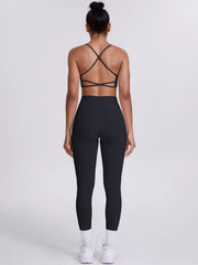 Garment detail view of criss-cross back cami and leggings active set