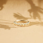 Flower band ring displayed in warm light