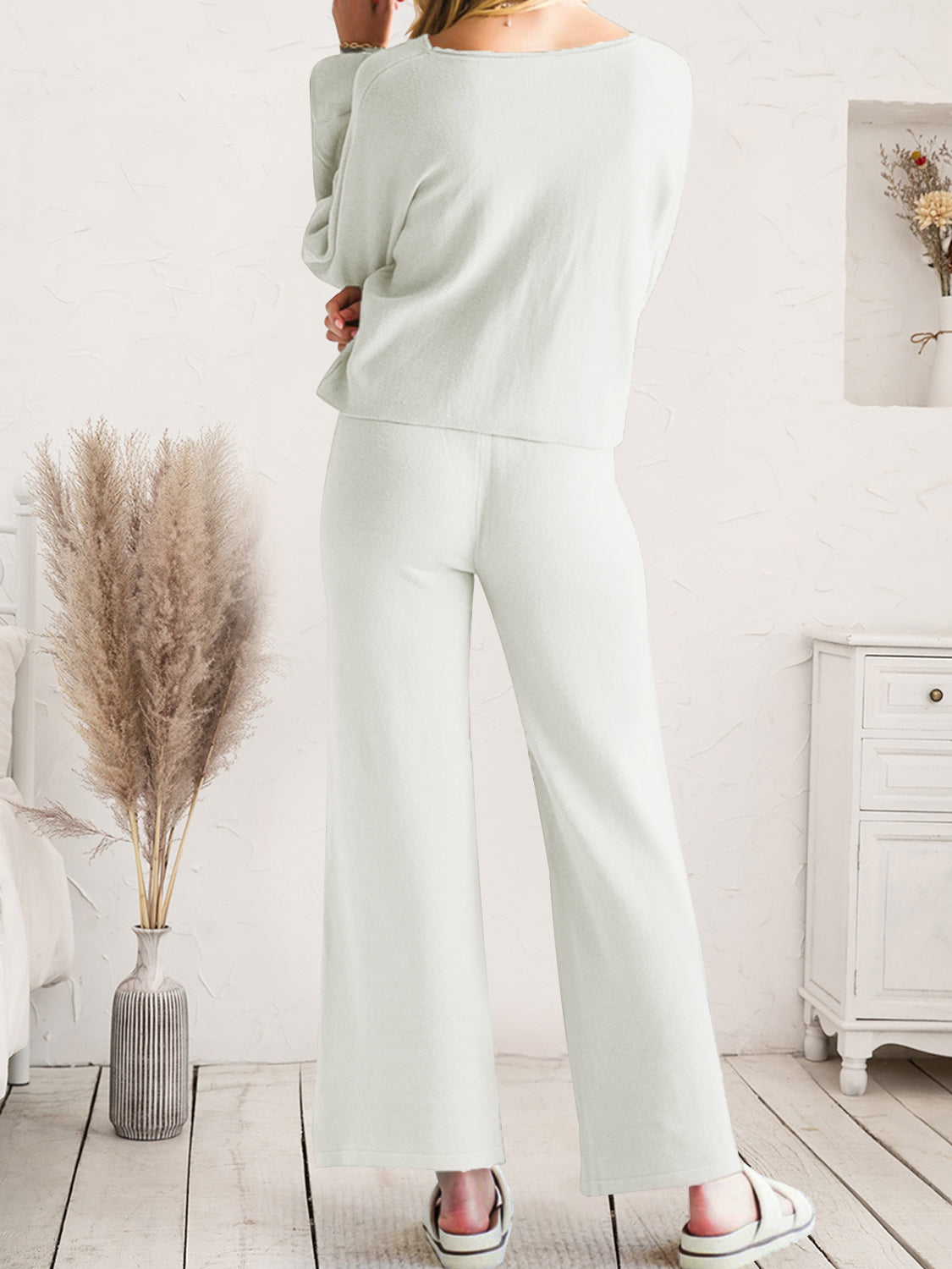 Close view of white long-sleeve lounge top and drawstring pants