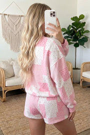 Blush pink patchwork pullover and shorts set shown from the side and back