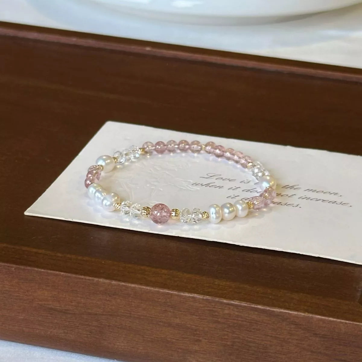 Freshwater pearl and crystal bracelet arranged on a card