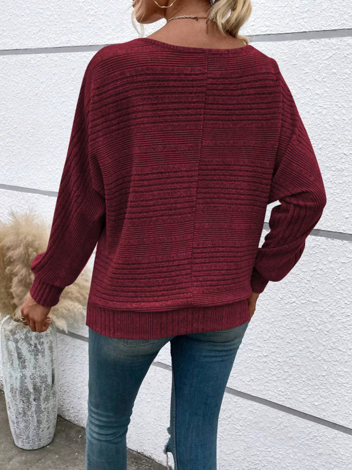 Women’s ribbed round-neck long-sleeve top in burgundy back view