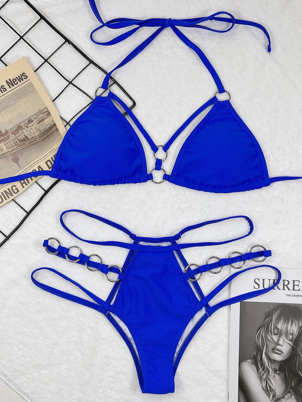 Pink cutout halter bikini laid flat, showing white cup lining