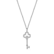 Silver key-shaped necklace pendant with clear stones shown on white
