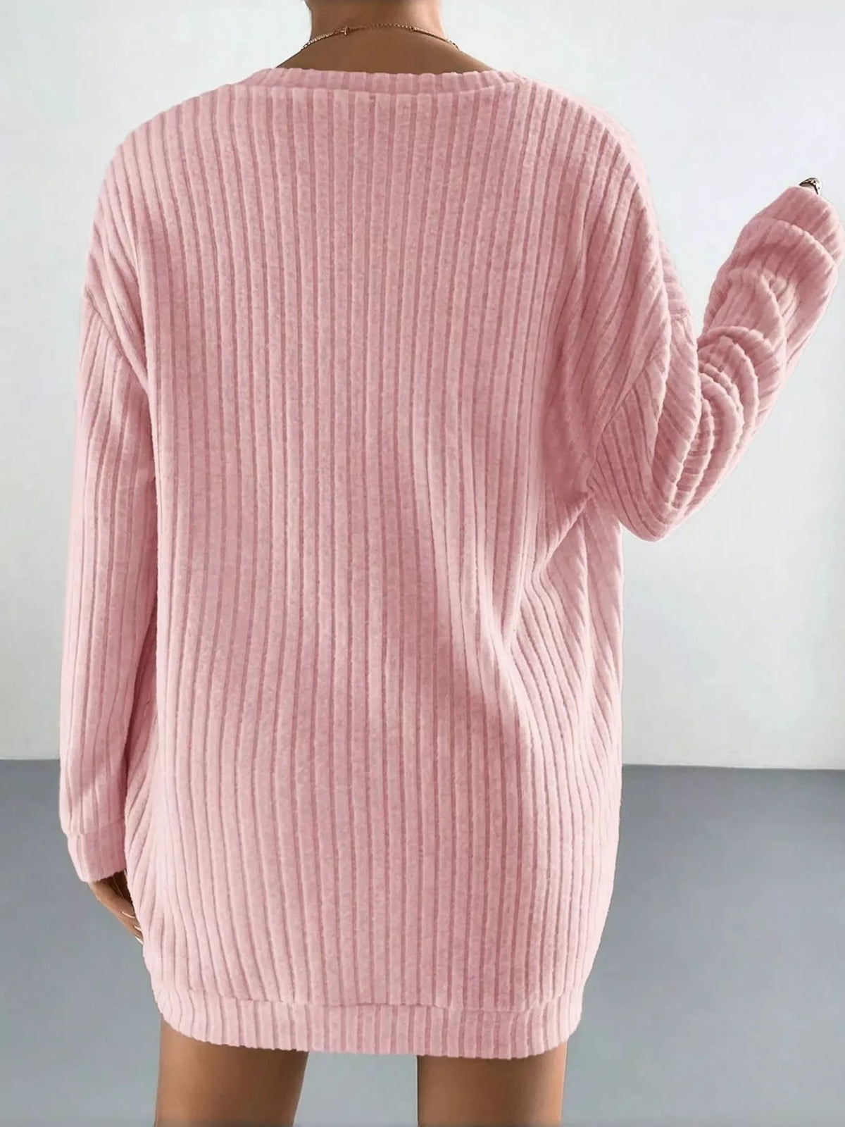Back view of the pink longline ribbed cardigan from the three-piece set