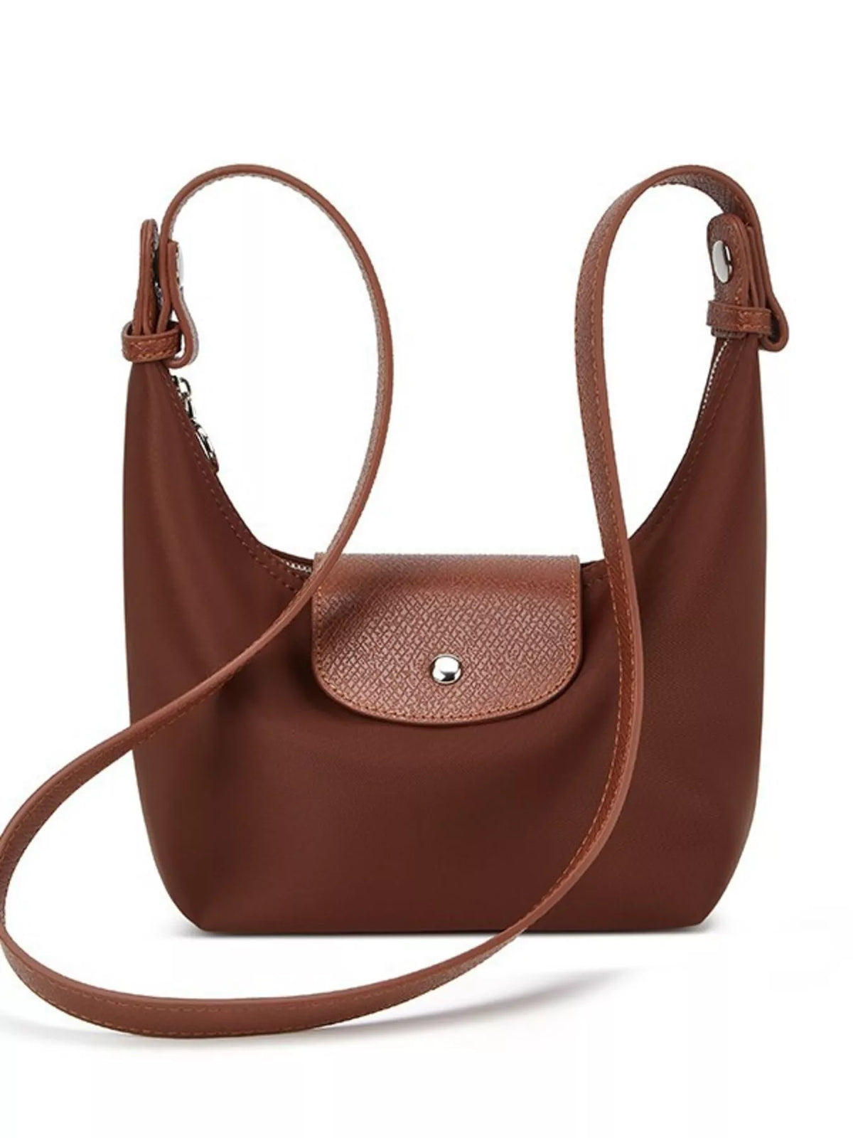Front view of the brown shoulder bag with its long strap draped across the front.